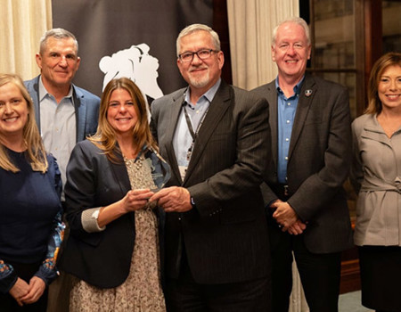 WWP executives honored CSX representatives with glass award.