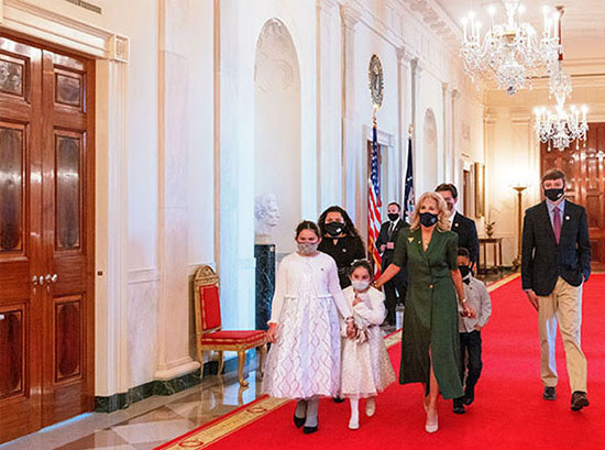 First Lady Jill Biden with a group of young Hidden Helpers at a White House event.