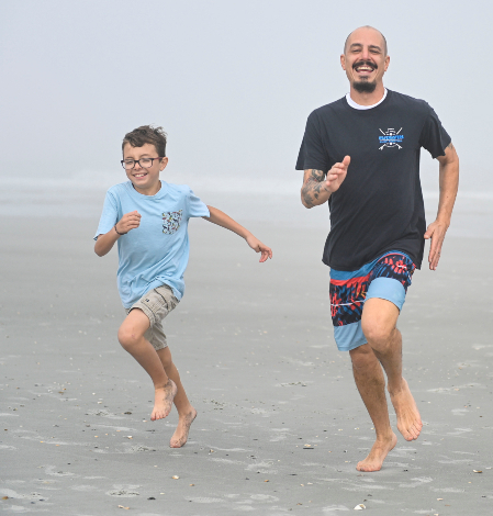 National Guard veteran running with son
