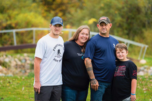 Marine veteran Phil Krabee with wife Melissa and their two sons.