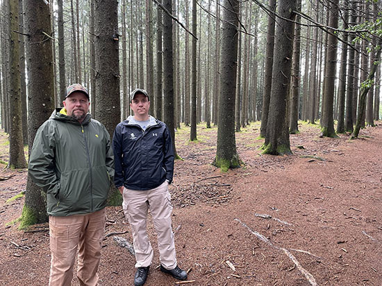 Veterans Brett Miller (left) and Brent Whitten (right), returned to Landstuhl Regional Medical Center in Germany, where they were medically evacuated years ago. While in the area, they visited a site from Battle of the Bulge in WWII.