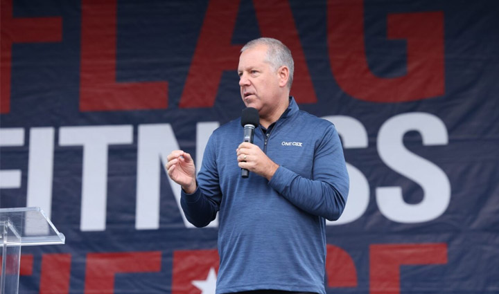 CSX President and CEO Joe Hinrichs speaks to participants at the 2023 Jacksonville Carry Forward 5K.