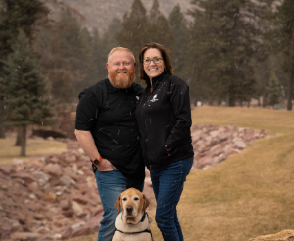 Scott and Shea Hughes (with his service dog Barnaby) serve as peer mentors for Project Odyssey adventure retreats after learning skills that helped improve their marriage.