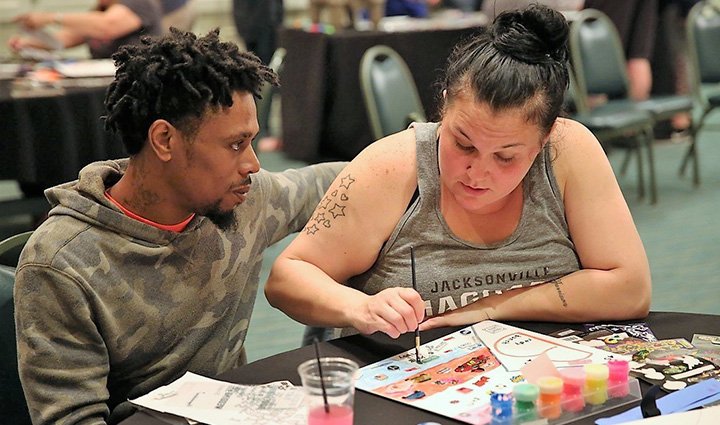 Wounded warrior Sidney Brandy and his wife participating in an activity during a couples Project Odyssey.