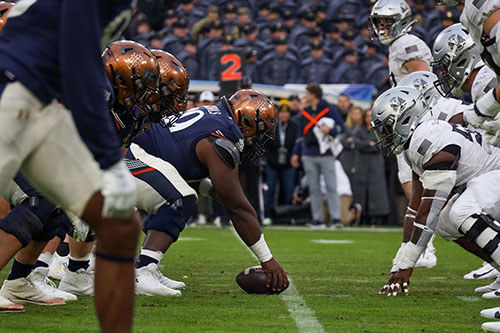 Army and Navy players lining up before a play during the 2025 matchup.
