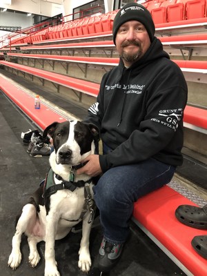 Veteran Michael Pais brought his entire family to the ice rink: wife, daughters, grandson, and Gator the dog. Being able to connect with other families is one of the things that keeps Michael engaged with Wounded Warrior Project® (WWP). This time, his family got to ice skate together and meet other veterans and families. Veteran, Michael Pais and his dog Gator