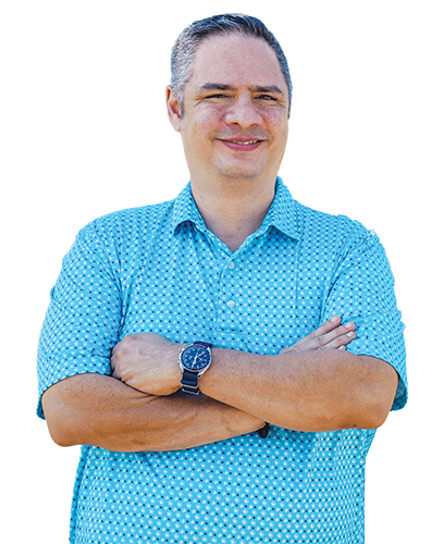 Wounded warrior Jason Major smiles with his arms folded.