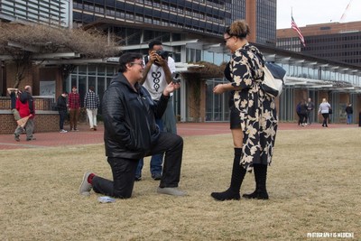 Army veteran Briana McCrae thought she was just posing for a photo in front of Liberty Bell Center with her boyfriend Frank Carr. Then he handed her a sauce packet that said, “Marry Me.” And produced an engagement ring. The couple was surrounded by a group of veterans from Wounded Warrior Project® (WWP), who were participating in a photography workshop. The group was in on the marriage proposal and continued snapping pictures. Frank got on one knee and popped the question on cue. Army veteran Briana McCrae being proposed to