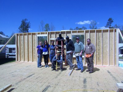 Wounded veterans build a wall during service project.
