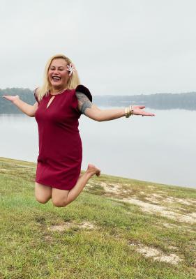 Faapepele (Pele) Hunkin, Army retiree, jumps for joy.