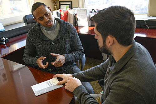 Wounded warrior Tyshawn Jenkins discusses Federal Benefits with a WWP team member.