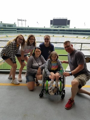 Retired National Guard veteran, Mike Zientek with his family at Lambeau Field during Wounded Warrior Project tour.