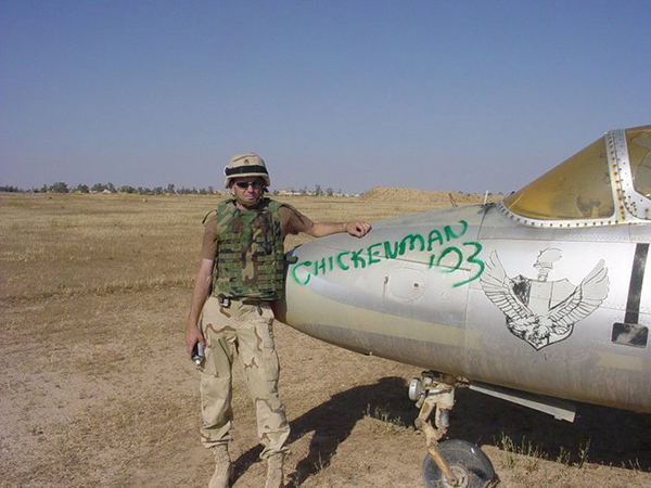 Army veteran William Childs poses for a photo on an aircraft in Iraq in 2009.