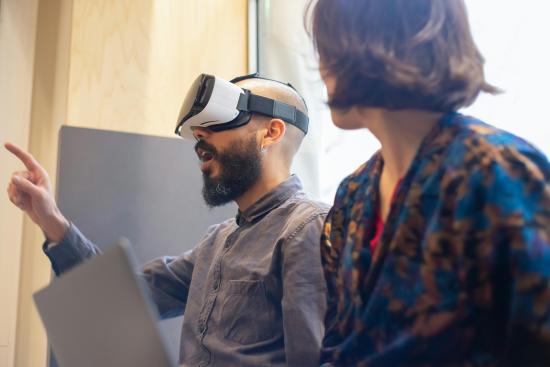 warrior with a virtual reality set and a person watching