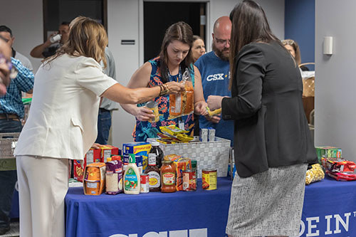 Volunteers from CSX put together food baskets to donate to wounded warriors and their families. (Photo courtesy of CSX Pride in Service)