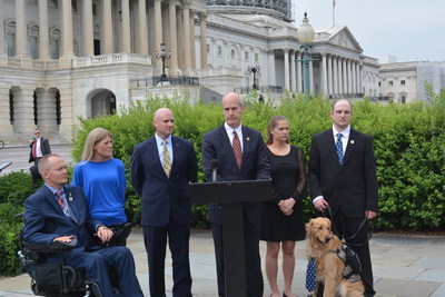US Rep. Rick Larsen (D - District 2, Washington) talks about the need for reproductive services for wounded veterans in front of the Capitol on June 15. Rep. Larsen is joined by Matt and Tracy Keil, WWP Director of Government and Community Affairs Sean Foertsch, and Christy and Jeff Lynch, and Woody.