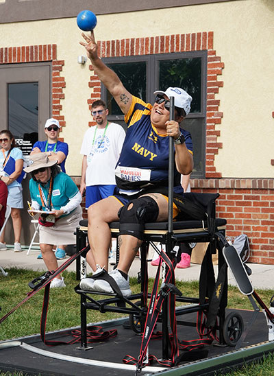 Maria Edwards throwing a shotput in the 2025 Warrior Games.