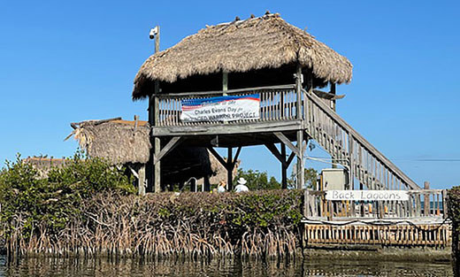 A banner proclaims it Charles Evans Day for Wounded Warrior Project at the Dolphin Research Center in the Florida Keys.