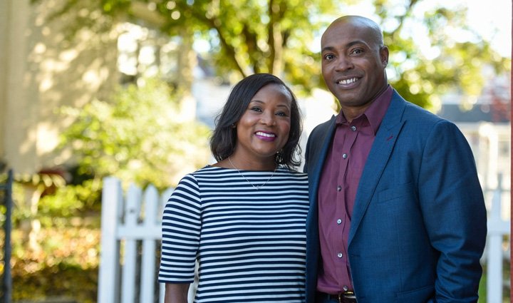 Warrior Sean Sanders smiles for a photo alongside his wife Darline.