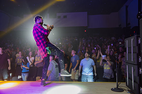 Rapper Shaggy, a Marine veteran, dances on stage while performing a live concert at Marine Corps Air Station Iwakuni, Japan.