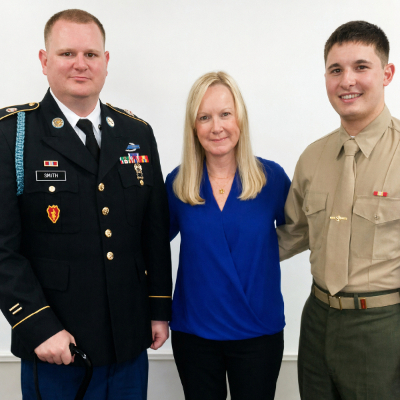 Jennifer Jenkins, her brother and son in uniforms