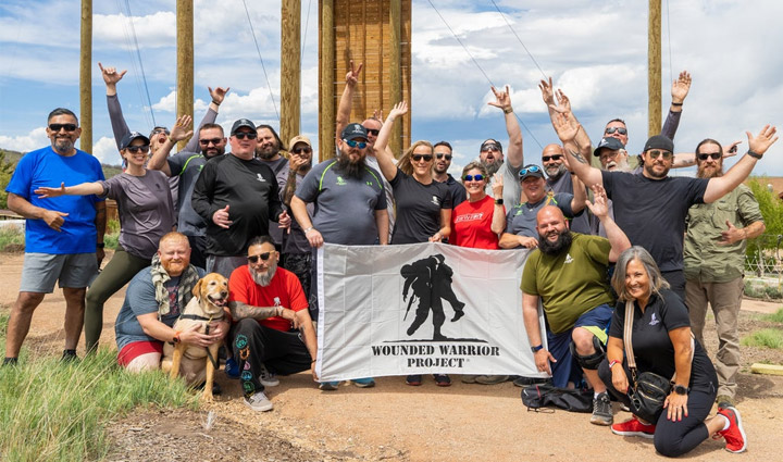 WWP warriors post for a group picture during a peer mentor event.