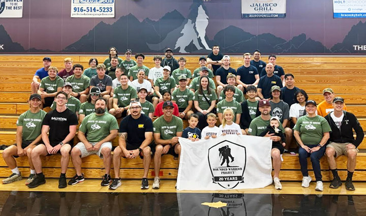 Student Athlets And Supporters At School Gym Bleachers