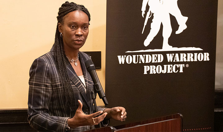 Wounded warrior Danielle Green speaking at the Corporate Partners Summit event