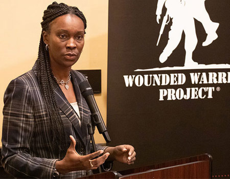 Wounded warrior Danielle Green speaking at the Corporate Partners Summit event