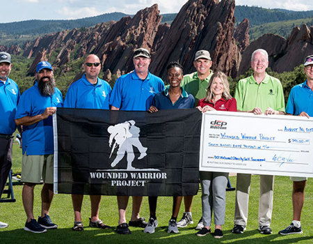 Corporate partner DCP Midstream presenting a donation check to Wounded Warrior Project teammates at the DCP National Charity Golf Tournament