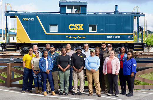 Warriors pose in front of the CSX's REDI Center in Atlanta.
