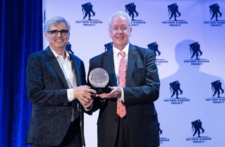 Steve poses with Chris Needles, WWP chief development officer, after receiving the 2024 Impact Award at Benefit for the Brave in Miami.