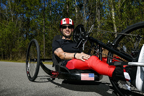 Veteran Mark Lalli on an adaptive bicycle.
