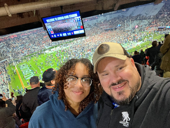 Jake Norotsky with oneof his children at an Auburn University football game.