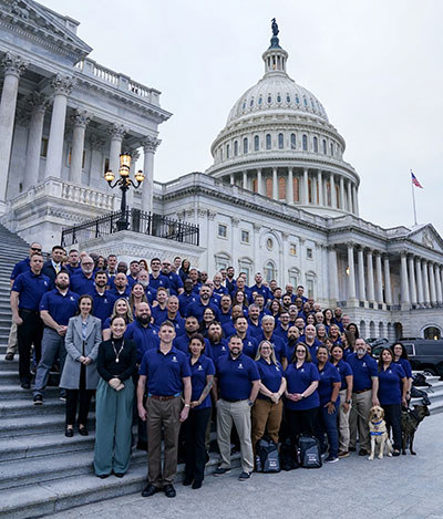 Warriors stand in front of the Capitol during a Congressional Fly-in as part of WWP's Operation Advocacy program to advocate for issues that impact veterans and their families.