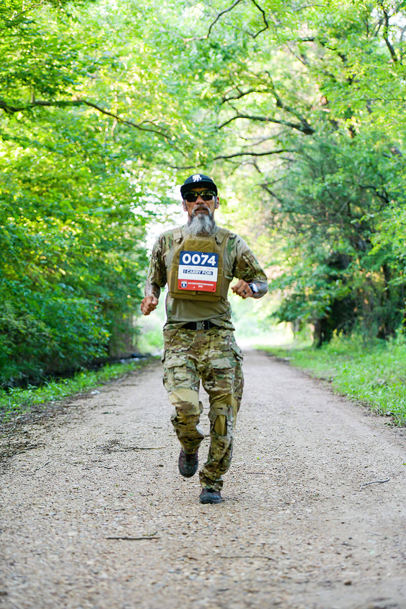 Wounded warrior Ray Andalio wearing camo clothes during a Carry Forward 5K event.