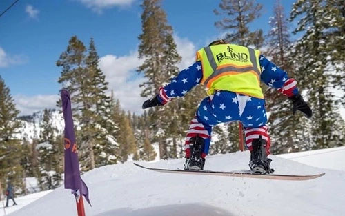 WWP warrior Mike Murphy goes airborne on a snowboard during an event at the Invictus Games.