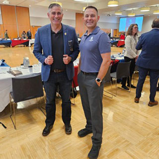 U.S. Rep. Michael Baumgartner stands with warrior advocate leader Lani Kelp at the Spokane convening.