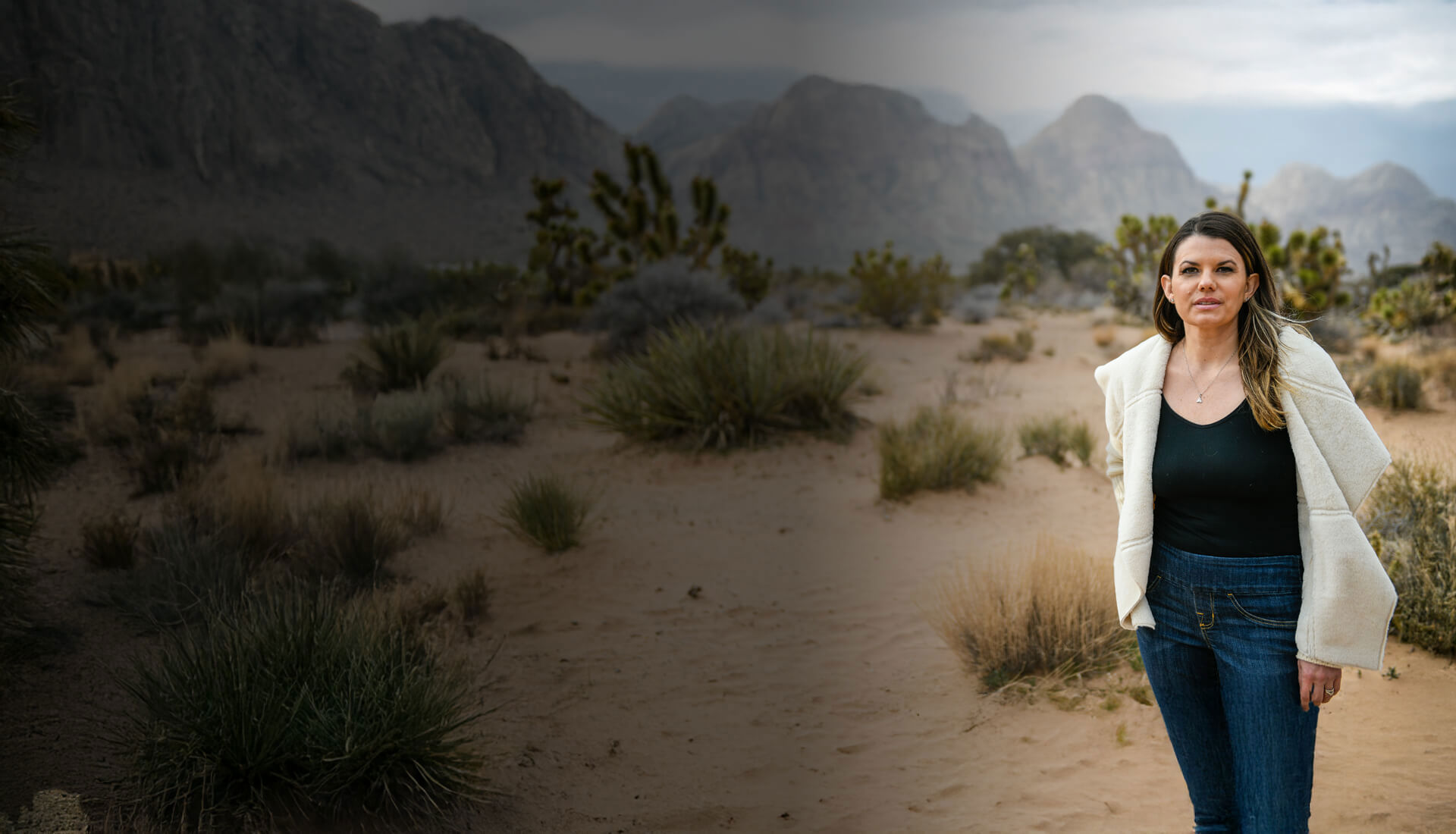 Wounded warrior Melissa McMahon poses in front of a desert background.
