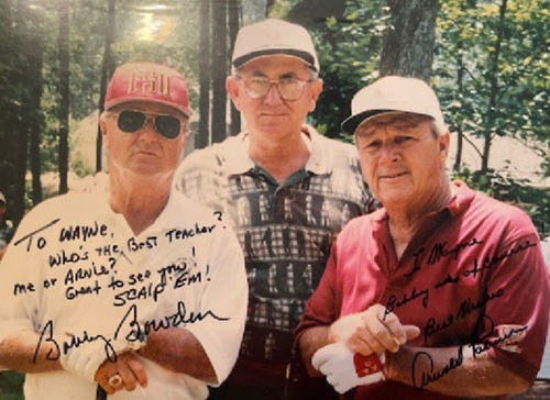 Vintage photo of three men standing outdoors, hand-signed by Bobby Bowden and Arnold Palmer to Wayne