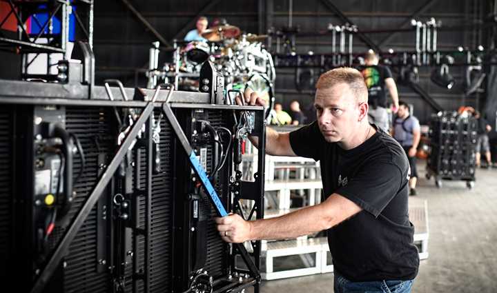 A wounded warrior works in an industrial setting. 