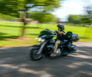 Warrior Ray Andalio rides his motorcycle.