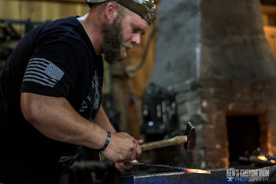 Wounded warrior working in blacksmith class 