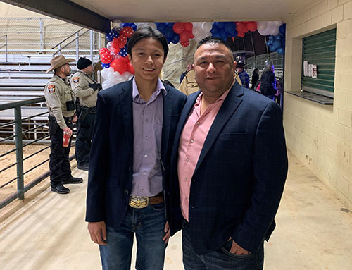 Marine veteran John Casares and son attend a Allcat WWP dinner.