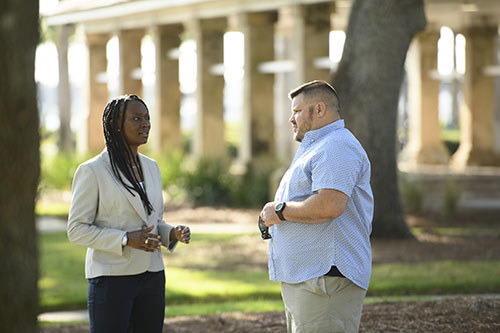 Army veterans Danielle Green and Jacob Norotsky speak to each other.