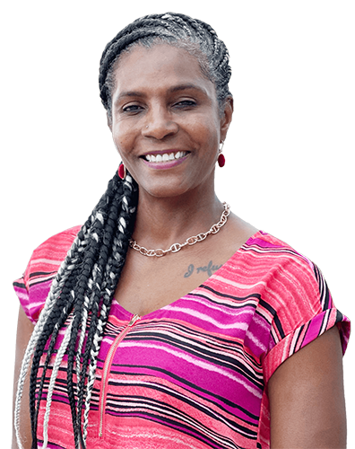Wounded warrior Tonya Oxendine smiles while wearing a brightly colored striped shirt.