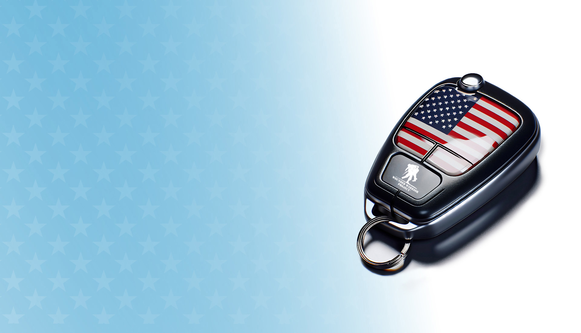 Key fob with American flag and WWP logo setting on a blue background with stars.