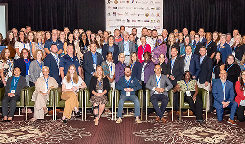 A group of WWP community partners pose for a photo.
