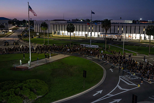 Members with U.S. Special Operations Command gather after completing a command run at MacDill Air Force Base.