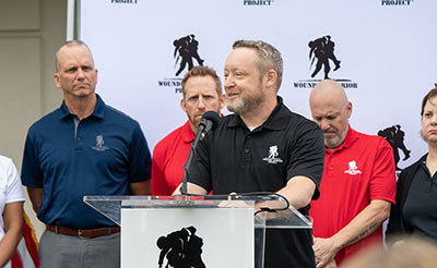 Veteran Andrew Myatt speaks during a Wounded Warrior Project event rallying for the passage of the PACT Act.